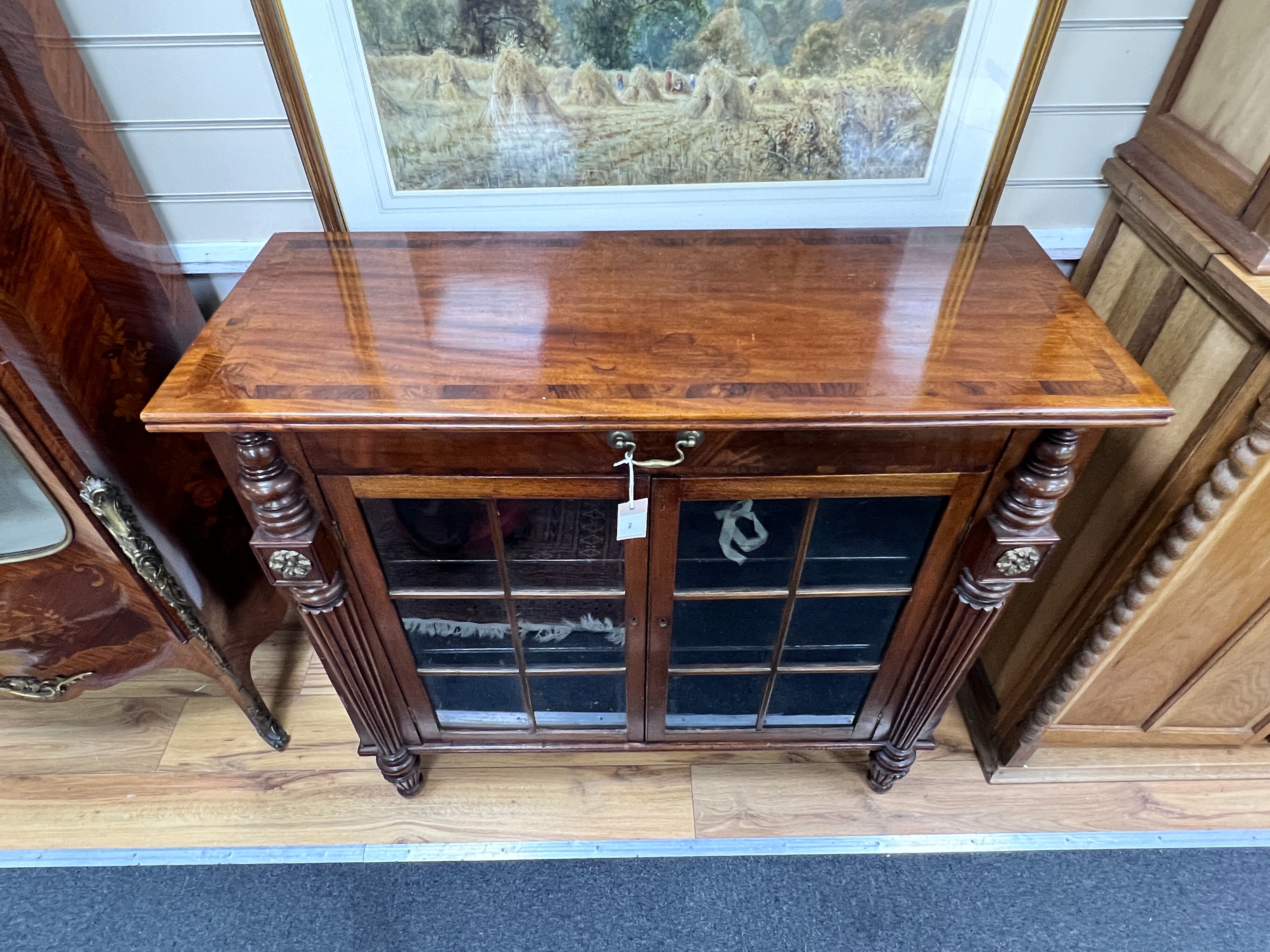 A George IV rosewood banded mahogany side cabinet, in the manner of Gillows, width 102cm, depth 40cm, height 93cm